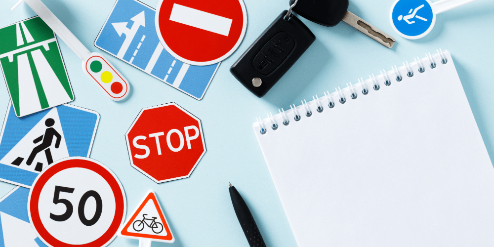road symbols with a note pad for noting down comparison cover information